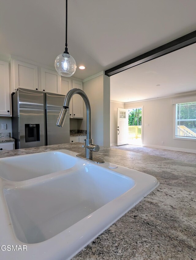 141 Hill Loop, Madisonville, TN 37354 - kitchen view of stainless steel fridge with ice dispenser, white cabinets, a sink, decorative light fixtures, and recessed lighting