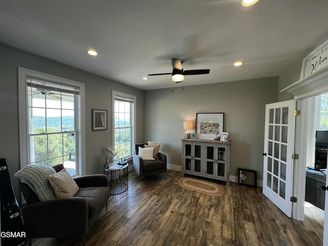 living area with baseboards, dark wood finished floors, a ceiling fan, and recessed lighting