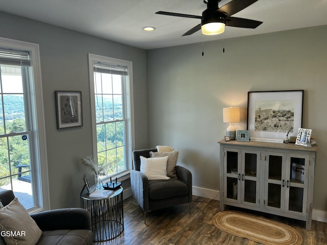 living area with dark wood-type flooring, recessed lighting, baseboards, and a ceiling fan