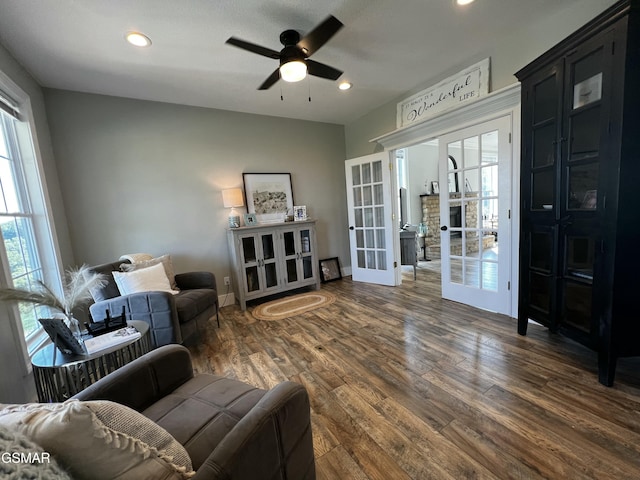 living area with dark wood-style floors, french doors, a ceiling fan, and recessed lighting