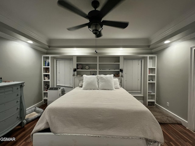 bedroom with baseboards, dark wood-type flooring, a ceiling fan, and crown molding