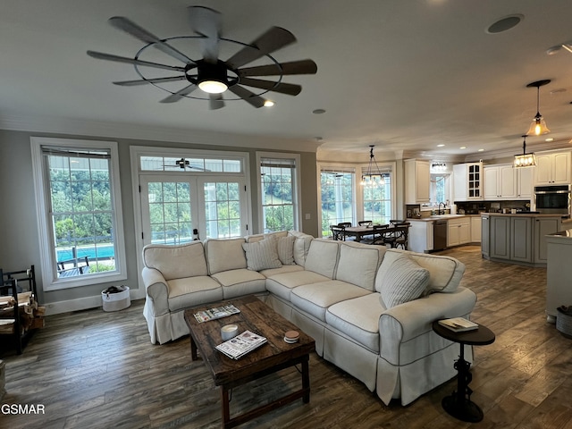 living area featuring recessed lighting, dark wood-style flooring, baseboards, french doors, and crown molding