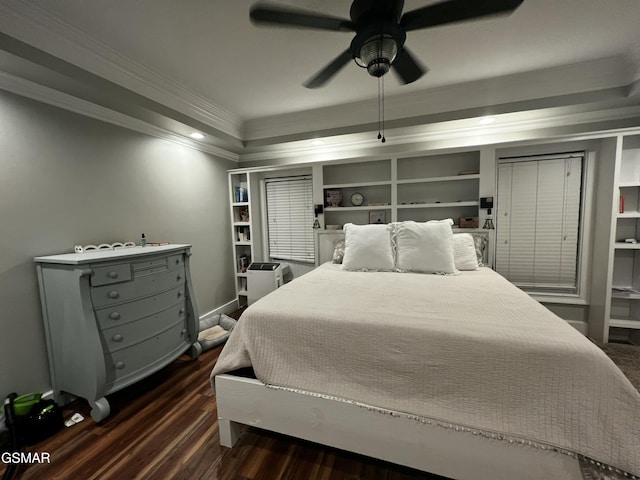 bedroom with dark wood-type flooring, crown molding, and a ceiling fan