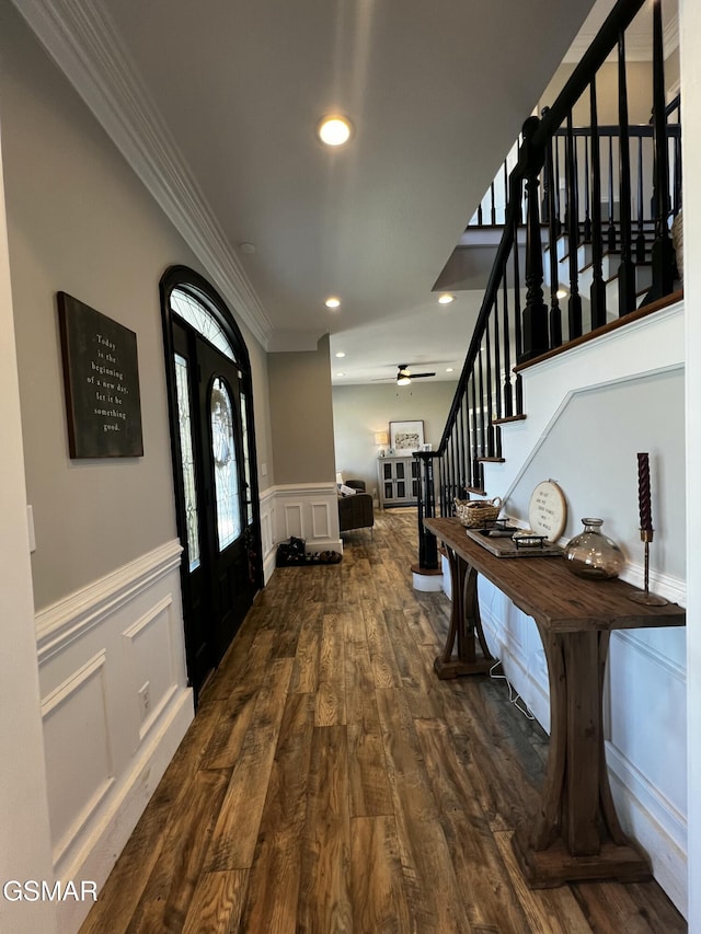 entryway with dark wood-style floors, recessed lighting, stairway, and ornamental molding