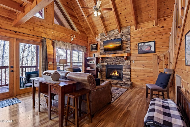 living room with hardwood / wood-style floors, high vaulted ceiling, wooden ceiling, and beamed ceiling