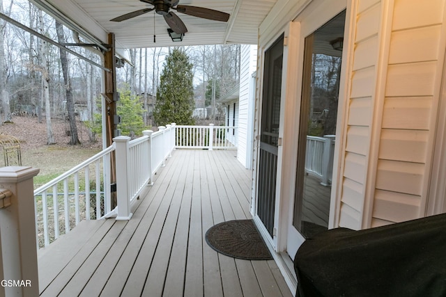 wooden deck with ceiling fan