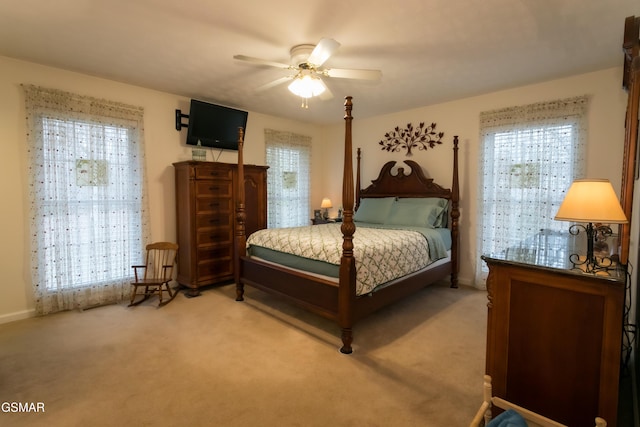 bedroom featuring ceiling fan and light colored carpet