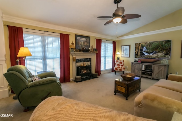 living room with a ceiling fan, lofted ceiling, carpet, crown molding, and a fireplace