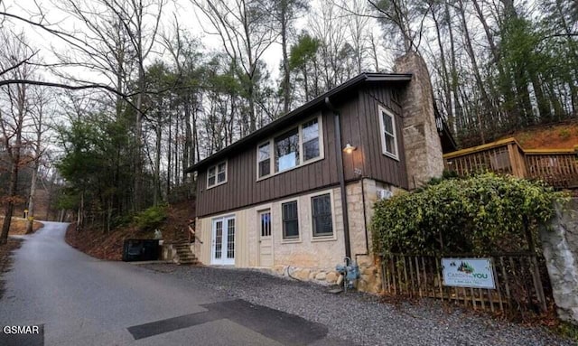 222 Poplar Ln, Gatlinburg, TN 37738 - view of side of home featuring french doors and board and batten siding