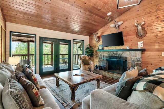 living area with a healthy amount of sunlight, wooden ceiling, and lofted ceiling