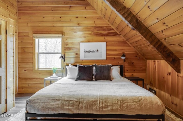 bedroom featuring lofted ceiling, wood walls, and wood ceiling