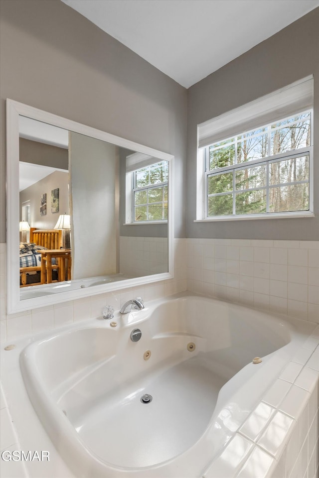 full bath featuring a jetted tub