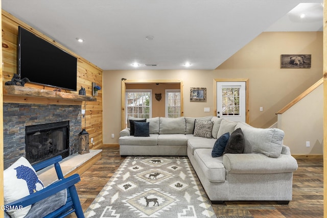 living area with a fireplace, baseboards, dark wood-type flooring, and recessed lighting