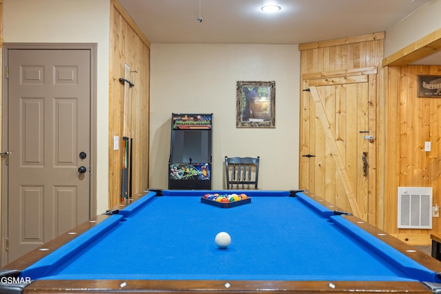 playroom with wood walls, visible vents, and pool table