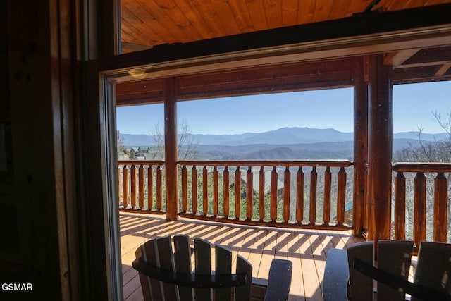 wooden deck featuring a mountain view