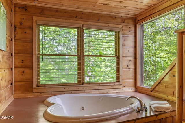 4110 Kidds Way Unit 5, Gatlinburg, TN 37738 - bathroom featuring wooden walls, a whirlpool tub, and wooden ceiling