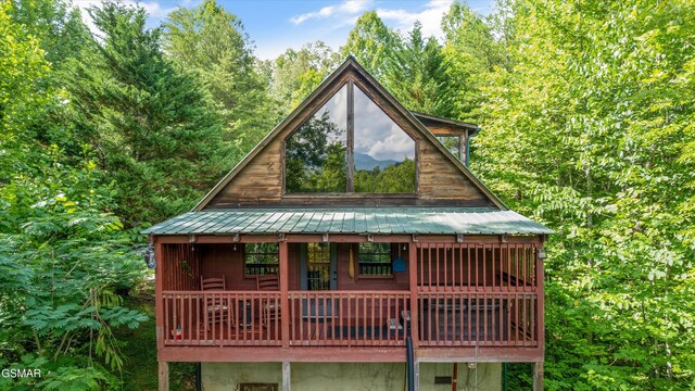 4110 Kidds Way Unit 5, Gatlinburg, TN 37738 - rear view of property featuring a metal roof, a wooden deck, and a forest view