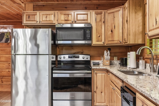 4110 Kidds Way Unit 5, Gatlinburg, TN 37738 - kitchen featuring appliances with stainless steel finishes, wood ceiling, and light stone counters