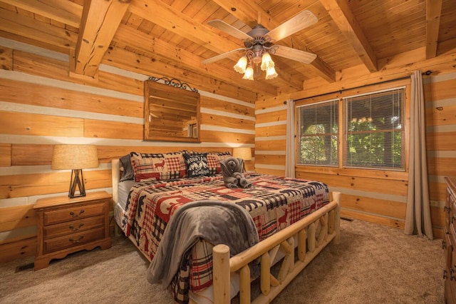 carpeted bedroom featuring ceiling fan, beam ceiling, wood ceiling, and wooden walls