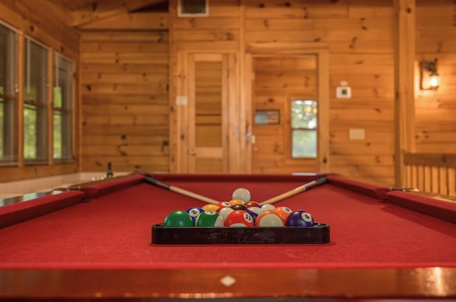 playroom featuring wood walls and billiards