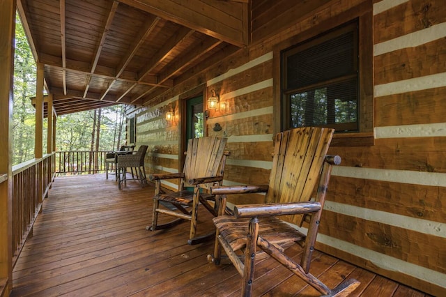 wooden terrace with a porch