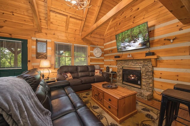 living room featuring wooden walls, beam ceiling, wooden ceiling, a chandelier, and a stone fireplace