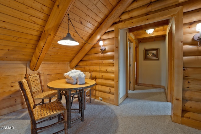 119 W Dumplin Valley Rd, Kodak, TN 37764 - carpeted dining area with rustic walls, beamed ceiling, baseboards, and wood ceiling