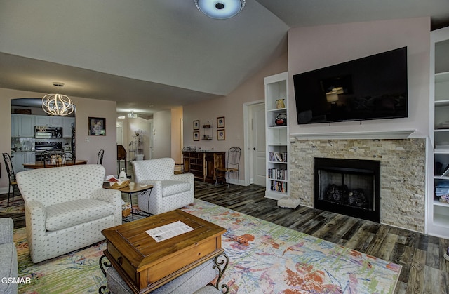 220 River Garden Ct Unit 38, Sevierville, TN 37862 - living area with wood finished floors, lofted ceiling, and a fireplace