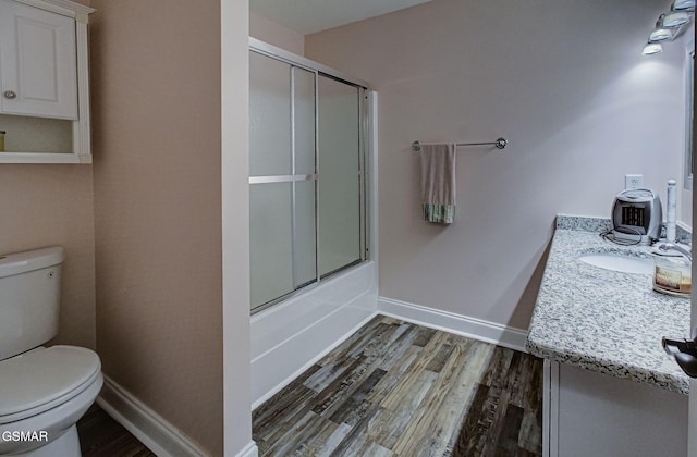 220 River Garden Ct Unit 38, Sevierville, TN 37862 - bathroom featuring toilet, baseboards, wood finished floors, and vanity