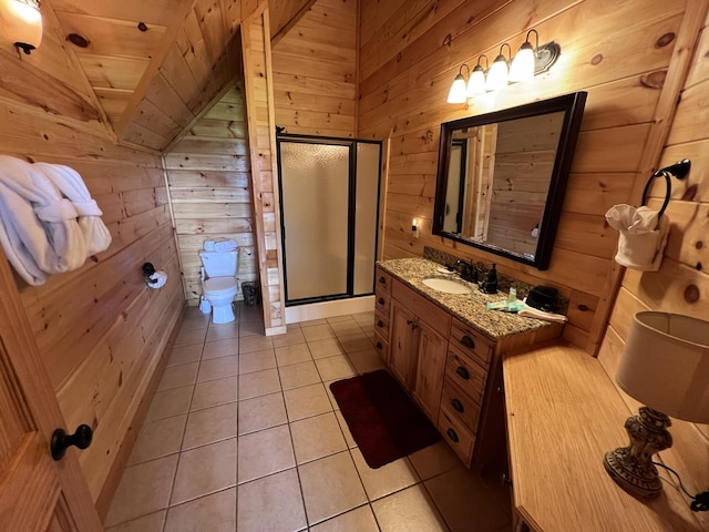 bathroom with tile patterned flooring, wood walls, a shower with door, and vaulted ceiling