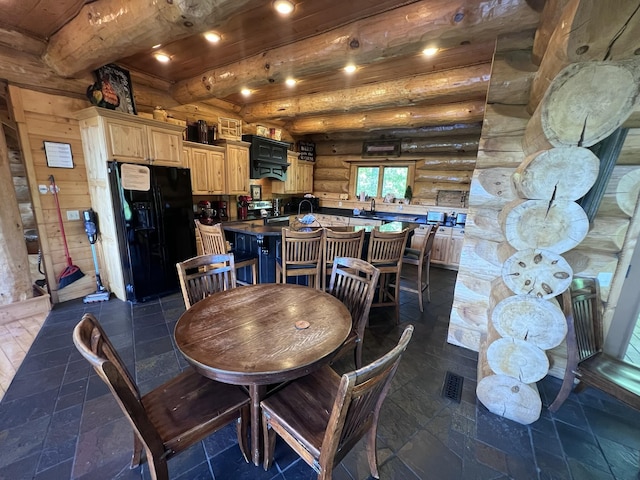 dining area with beamed ceiling, log walls, and wood ceiling