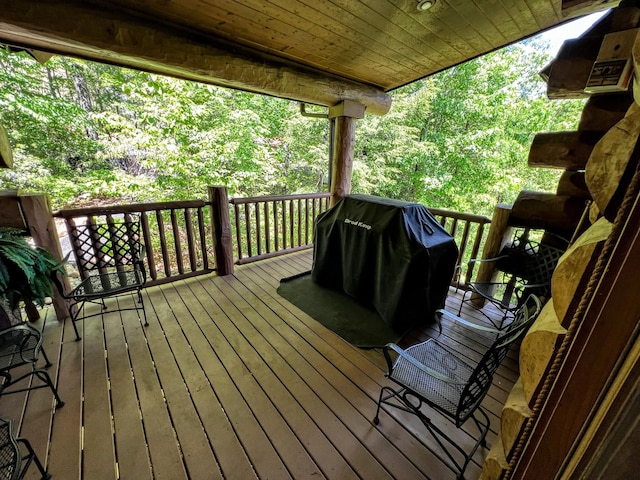 wooden deck featuring grilling area