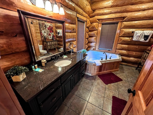 bathroom featuring vanity, toilet, a tub to relax in, and log walls