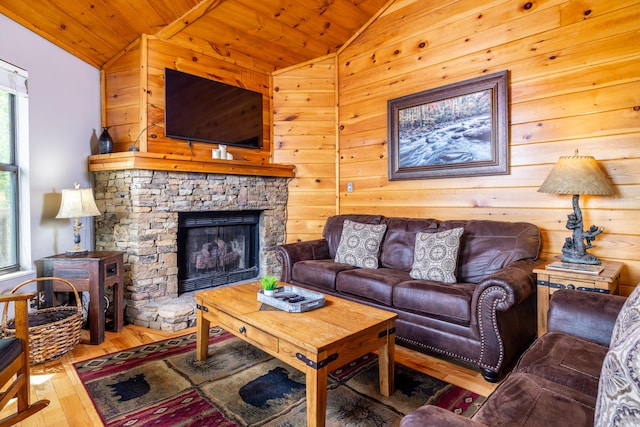 living room with wood-type flooring, wooden ceiling, wooden walls, and vaulted ceiling