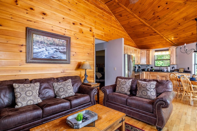 living room featuring wooden walls, wooden ceiling, vaulted ceiling, and light hardwood / wood-style floors