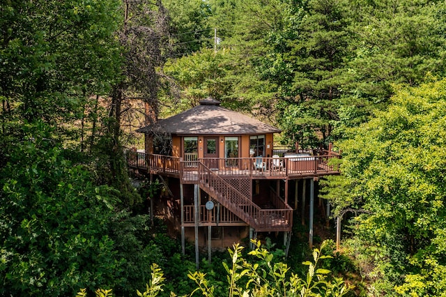 back of house with a wooden deck