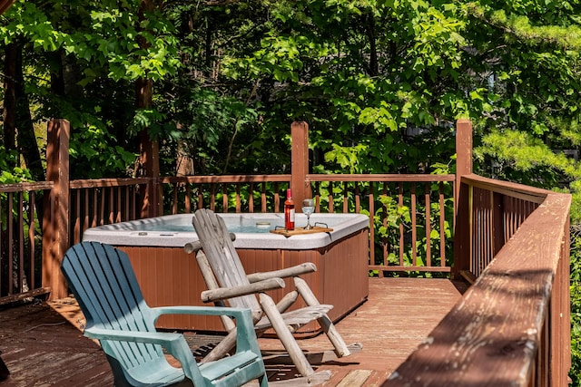 wooden terrace featuring a hot tub