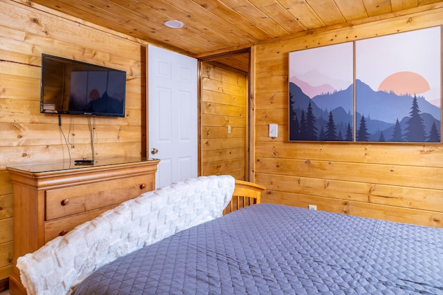 bedroom featuring wood walls and wooden ceiling