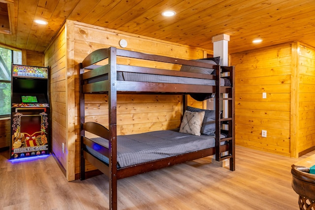 unfurnished bedroom with wood walls, wooden ceiling, and wood-type flooring