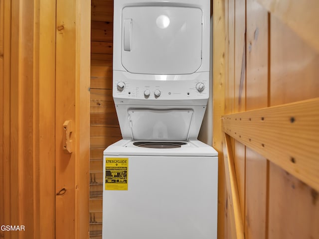 1518 Ridgecrest Dr, Sevierville, TN 37876 - laundry area featuring stacked washer / drying machine and wooden walls