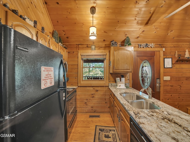 1518 Ridgecrest Dr, Sevierville, TN 37876 - kitchen featuring black appliances, a sink, wooden walls, light wood-type flooring, and vaulted ceiling