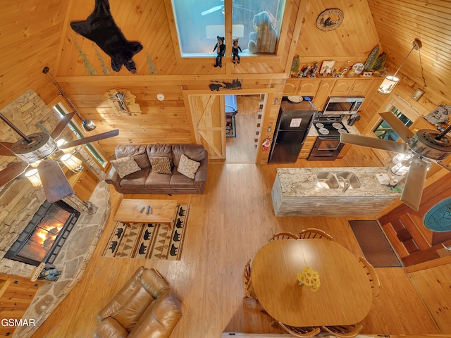 1518 Ridgecrest Dr, Sevierville, TN 37876 - living area featuring wooden walls, high vaulted ceiling, and wood finished floors