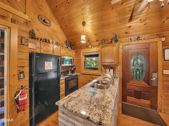 1518 Ridgecrest Dr, Sevierville, TN 37876 - kitchen with black appliances, a sink, wood walls, light wood-type flooring, and vaulted ceiling