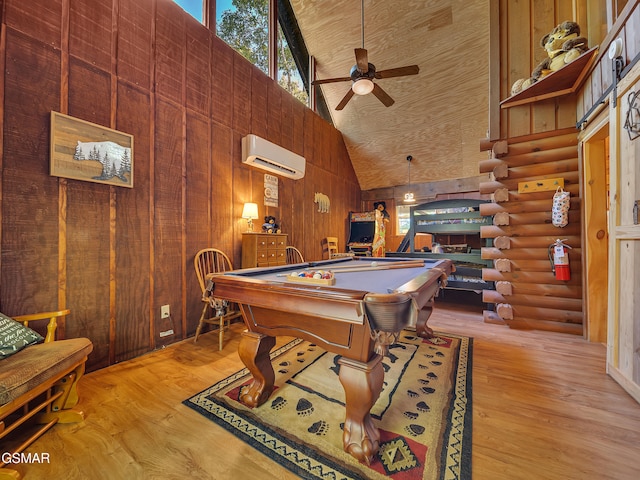 1518 Ridgecrest Dr, Sevierville, TN 37876 - game room featuring a wall unit AC, high vaulted ceiling, rustic walls, ceiling fan, and wood finished floors