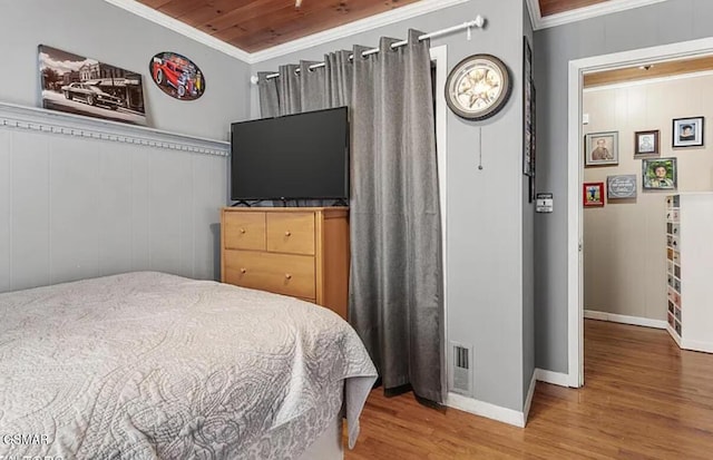 211 Valley Dr, Pigeon Forge, TN 37863 - bedroom featuring wood finished floors, ornamental molding, and wooden ceiling