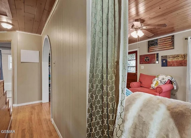 211 Valley Dr, Pigeon Forge, TN 37863 - bedroom featuring crown molding, arched walkways, wooden ceiling, wood-type flooring, and wooden walls