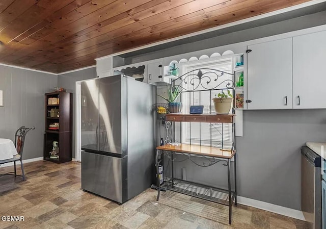 211 Valley Dr, Pigeon Forge, TN 37863 - kitchen with freestanding refrigerator, wooden ceiling, and white cabinetry