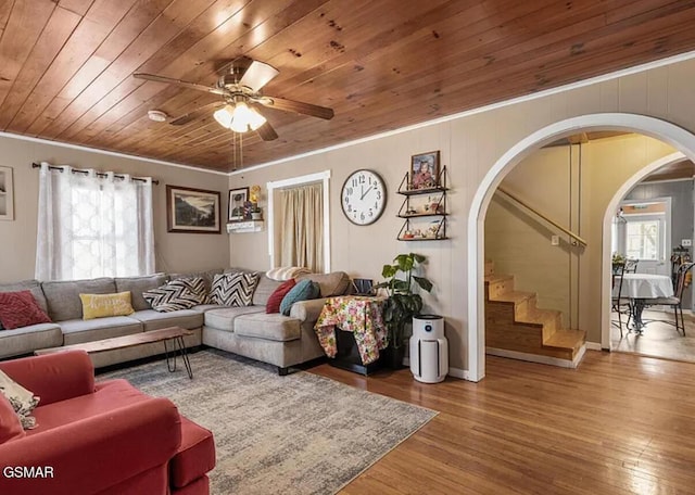 211 Valley Dr, Pigeon Forge, TN 37863 - living room with arched walkways, ceiling fan, wood finished floors, crown molding, and stairway