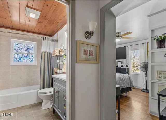 211 Valley Dr, Pigeon Forge, TN 37863 - full bath featuring shower / bathtub combination with curtain, ceiling fan, vanity, wood ceiling, and tile patterned floors
