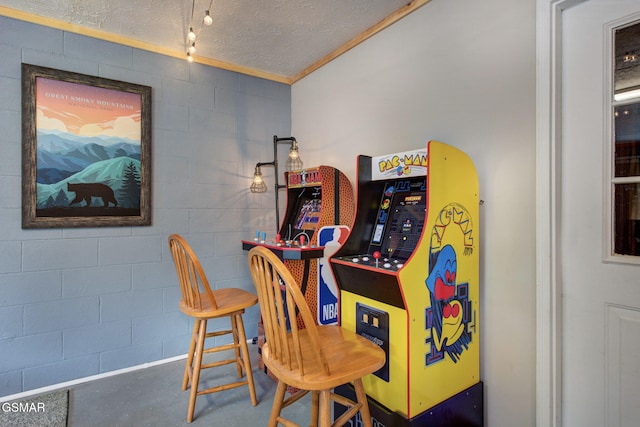 1315 Mccarter Hollow Rd, Sevierville, TN 37862 - bar with ornamental molding, a textured ceiling, concrete block wall, and concrete floors